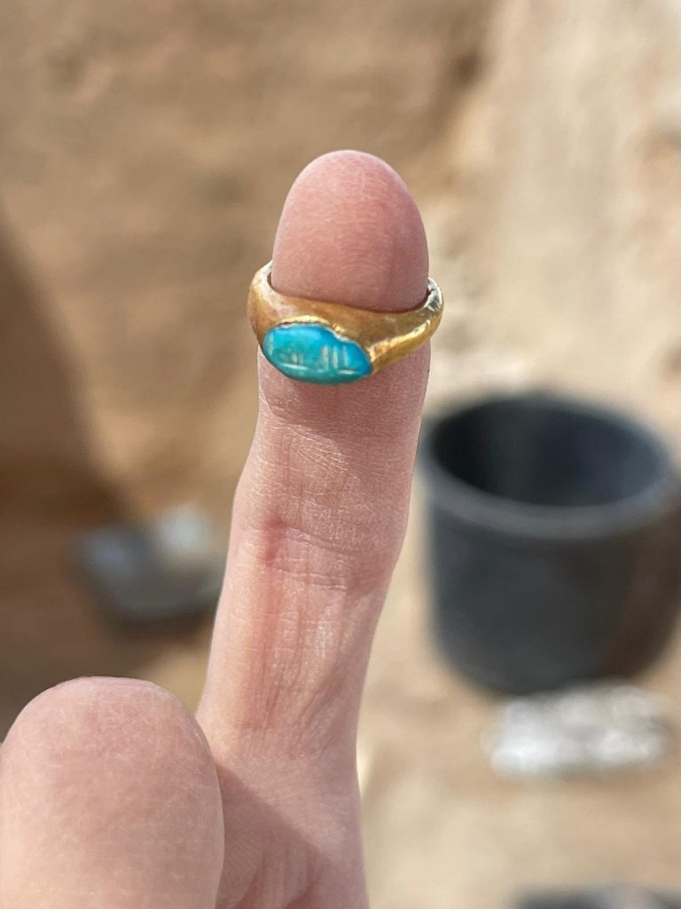 Child-sized gold ring on finger