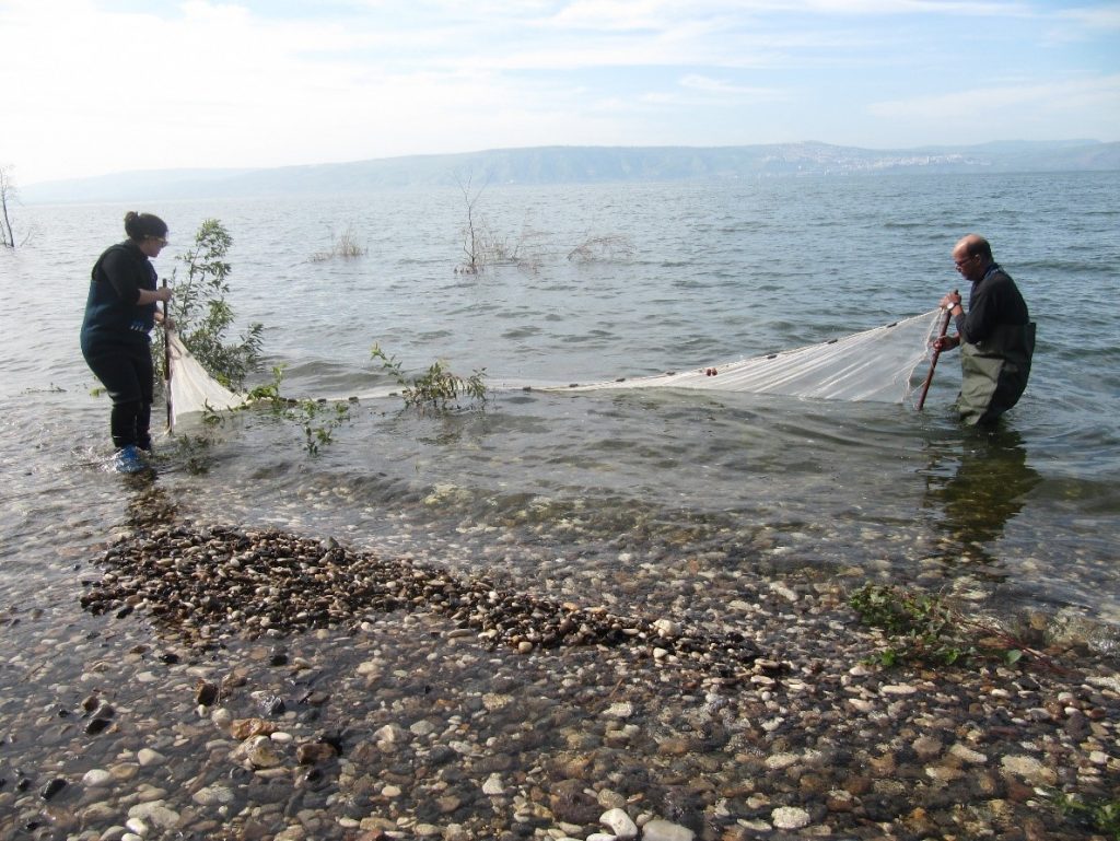 Roni Tadmor on the left, alongside the late Tomer Borovsky on the right, conducting sampling near the Sea of Galilee for the coffee chain.