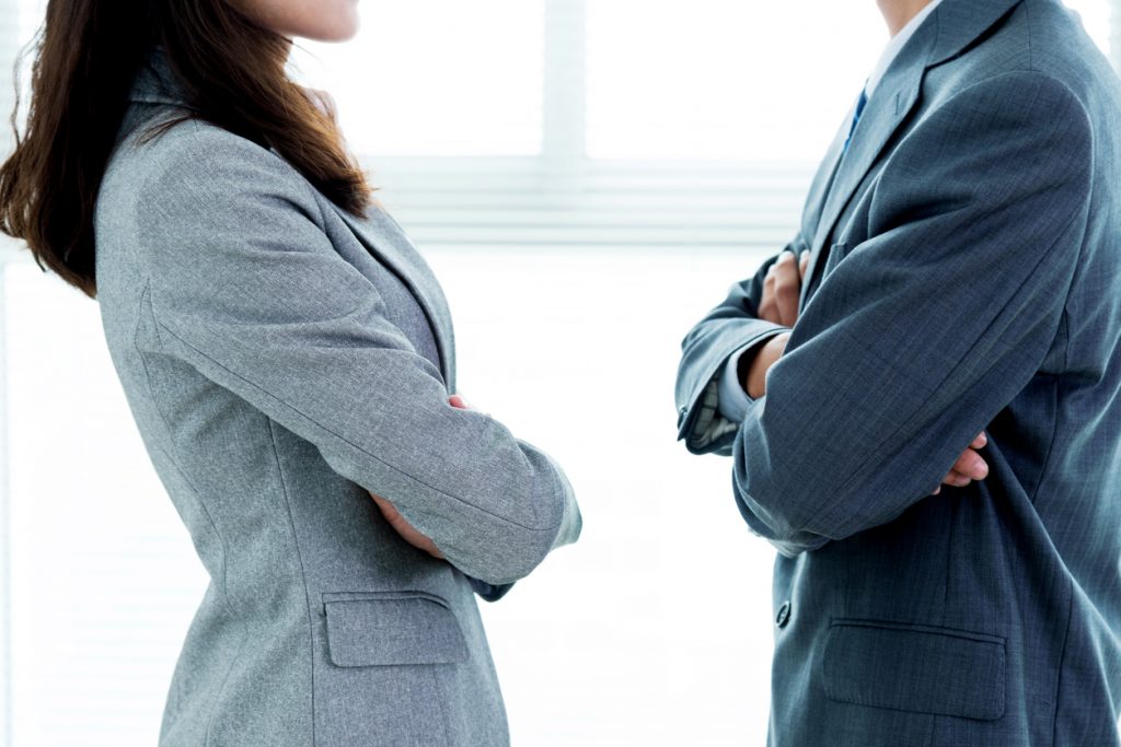 Two businesspeople standing face to face